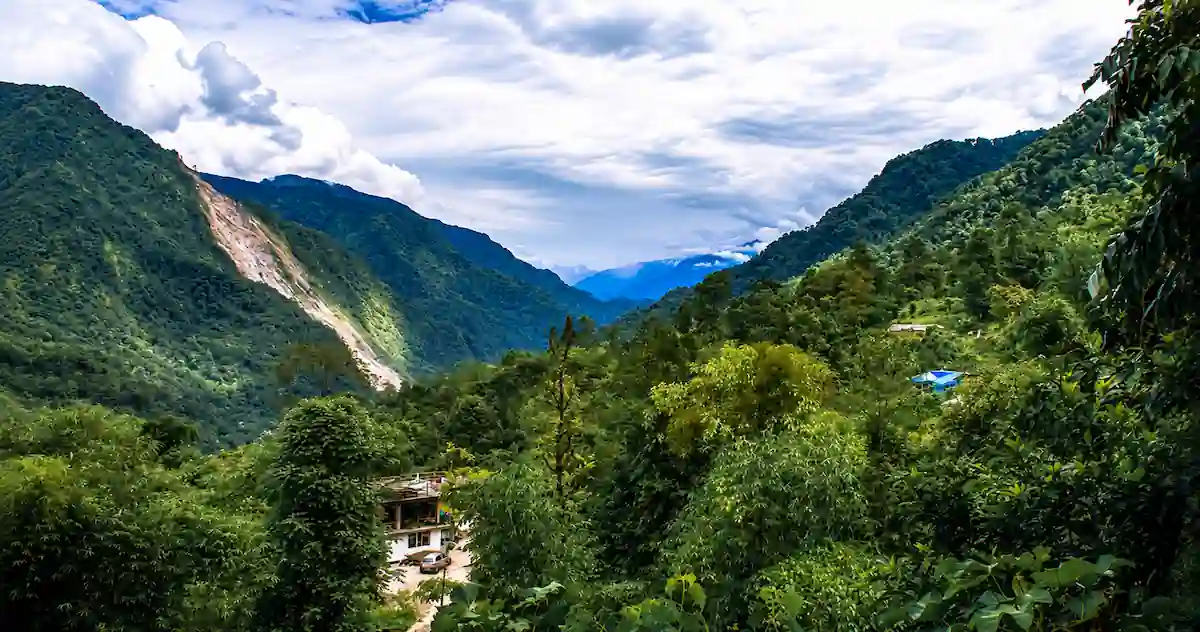 Lush green mountains and a local homestay in Dzongu Valley, North Sikkim.