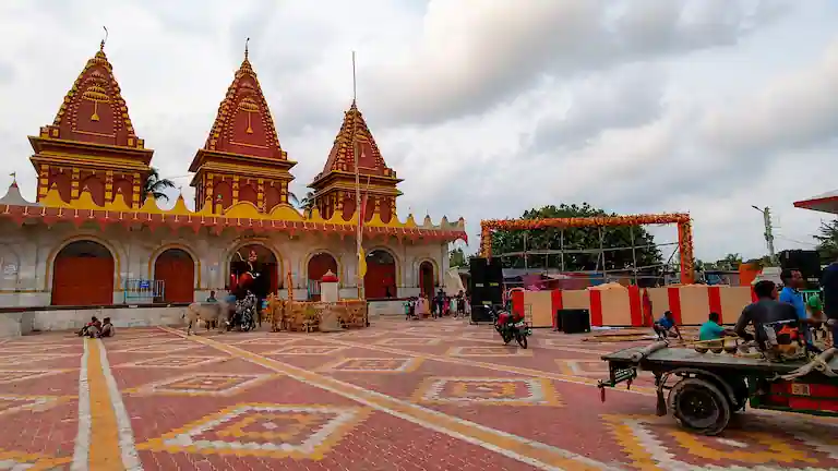 The bright red and yellow Kapil Muni Temple complex on Sagar Island.