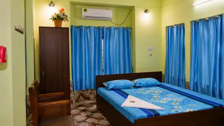 Inside a double bed AC room at the Henry Island WBSFDC guest house.