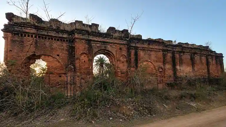 Ruined brick walls and stone archways of the ancient Keshargarh Fort in Purulia.