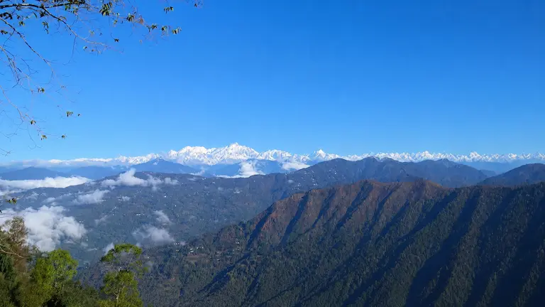 Scenic mountain view of Kanchenjunga snow peaks from offbeat places near Kalimpong.