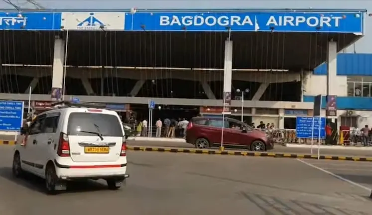 Exterior view of Bagdogra Airport with taxis waiting at the terminal.