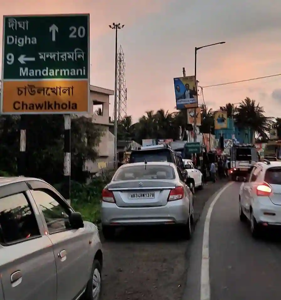 Highway signboard at Chaulkhola junction pointing towards Mandarmani and Digha