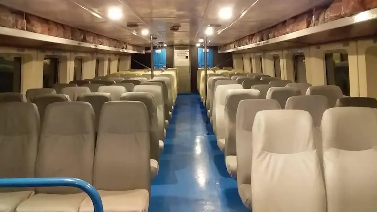 Clean interior seating inside the government ferry to Gangasagar.