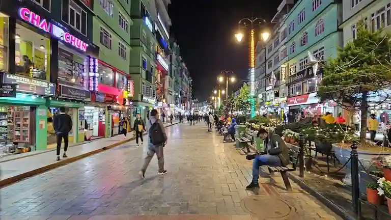 Illuminated MG Marg pedestrian street in Gangtok at night.