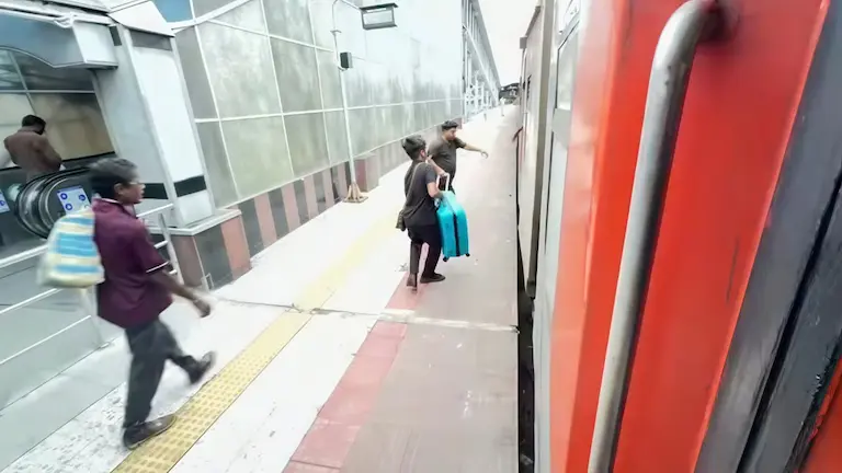 Passengers boarding a train as a comfortable alternative to driving.