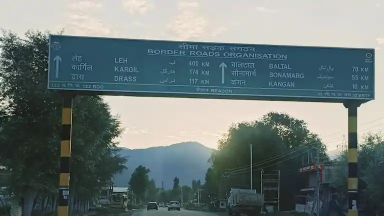 Official BRO highway signboard showing the Srinagar to Kargil distance.