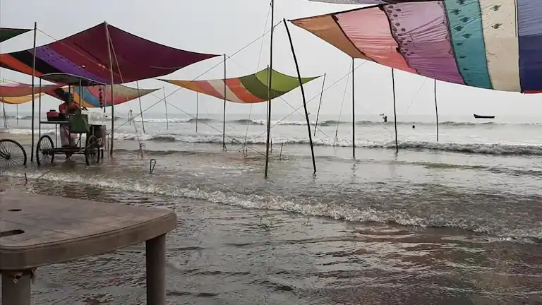 High tide flooding the temporary food stalls at Udaipur Beach, Digha.