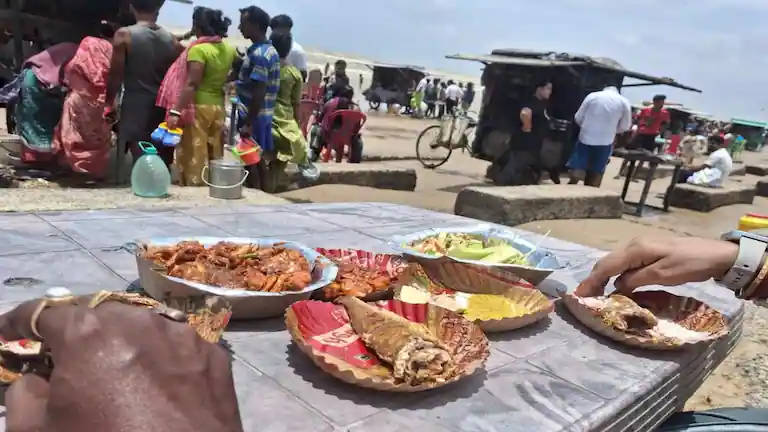 Deep-fried fish and crabs served at a local food stall on Udaipur Beach.