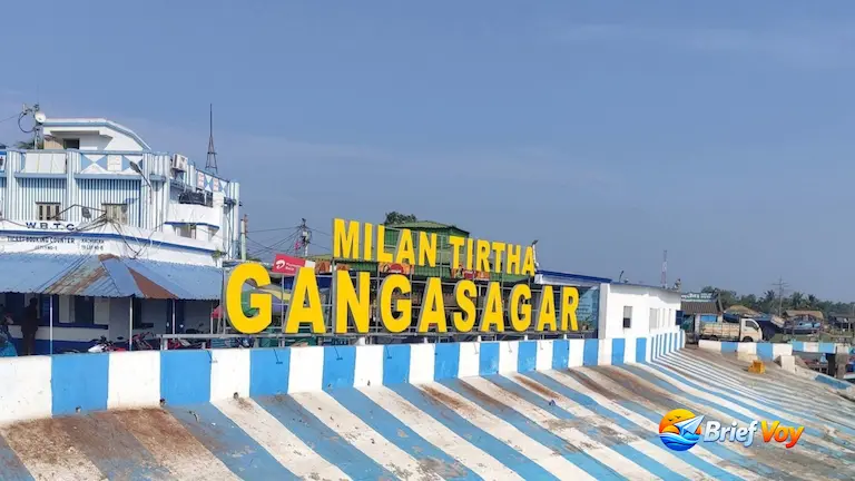 Milan Tirtha Gangasagar sign and WBTC offline ticket counter at the ferry jetty for travelers covering the Kakdwip to Gangasagar Distance.