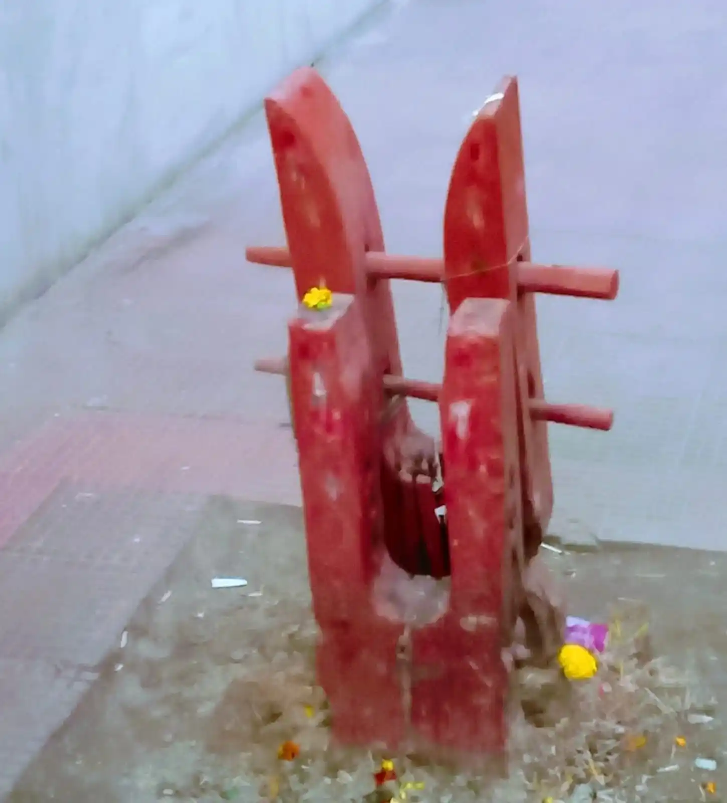 Traditional red wooden Balikath sacrificial post at Sarbamangala Temple Burdwan.