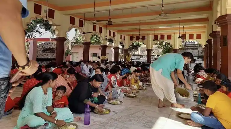 Devotees eating Anna Bhog prasad at Sarbamangala Temple Burdwan.