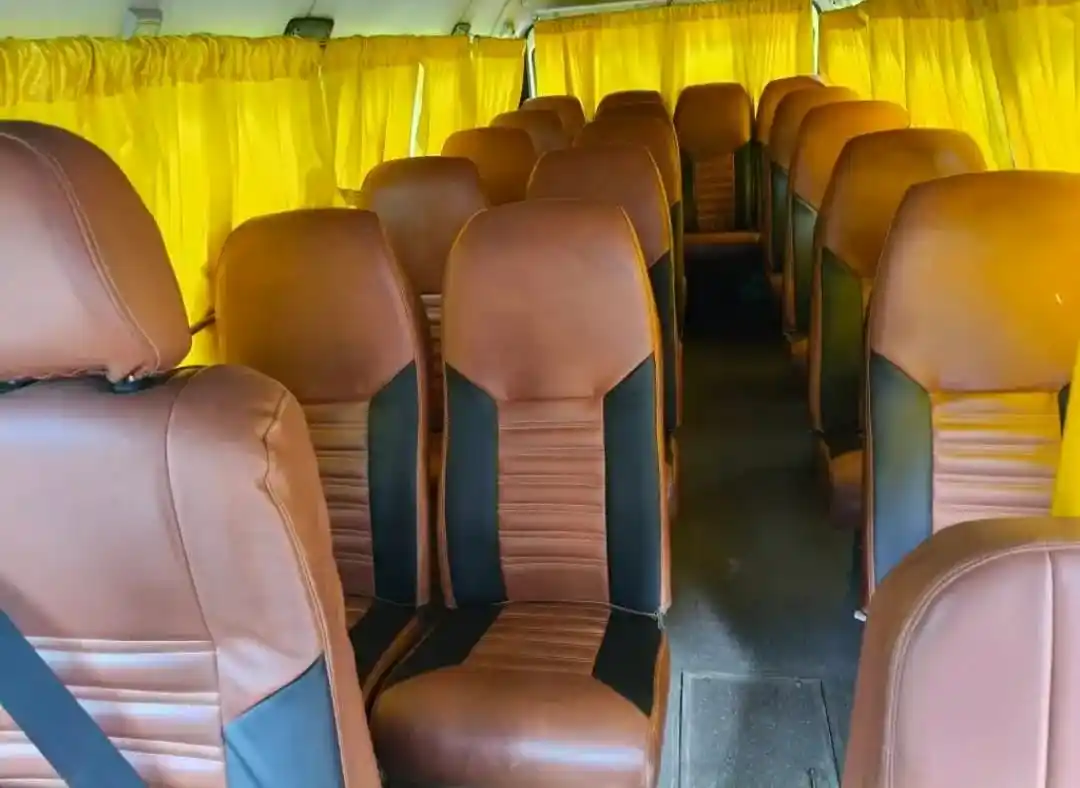 Interior view of AC Tempo Traveller pushback seats in Kolkata.