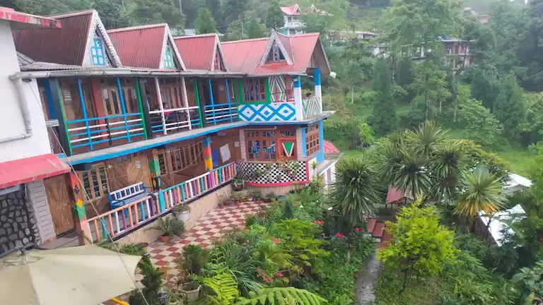 Exterior view of Abiraj Homestay with wooden floors in Tinchuley.