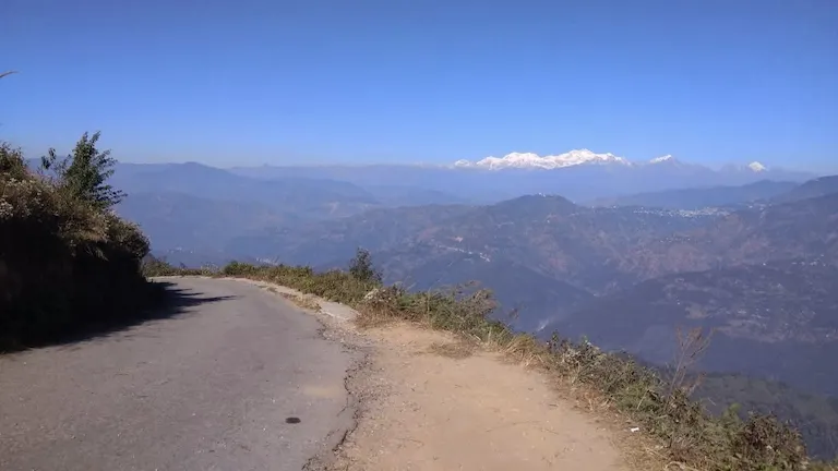 Clear view of snow-capped mountain peaks from the winding roads of Tinchuley.