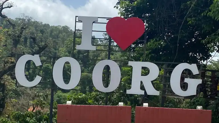 I Love Coorg signboard along the route near Madikeri.