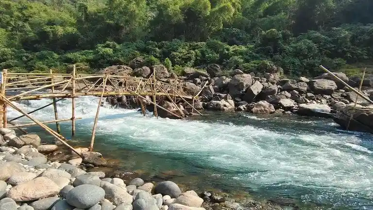 Bamboo bridge over the clear Umngot River in Shnongpdeng