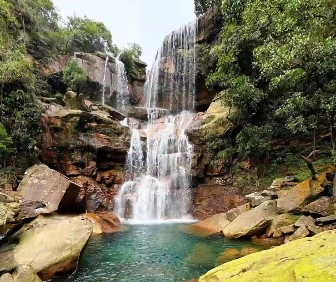 Three-tiered Wei Sawdong waterfall in Cherrapunji flowing into a clear pool